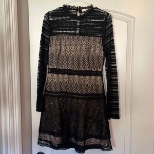 Long sleeve black lace and nude lined cocktail dress